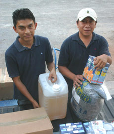 Juan and Luis delivering food and produces to the MFIL Nutrition Health Center at Xcalacoop